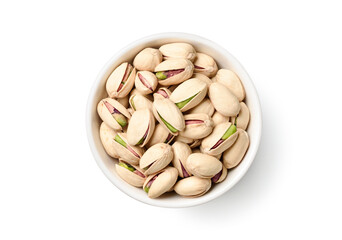 Flat lay of pistachio nuts in white bowl isolated on a white background.
