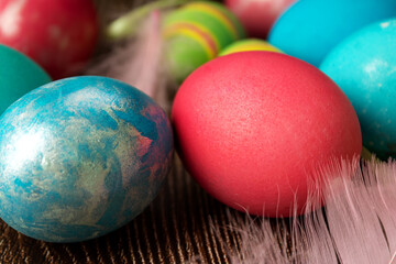 Painted eggs, on a wooden table, in a close-up