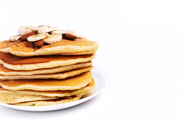 Pancake with bananas on a white background, isolated, in a close-up, with a place for text