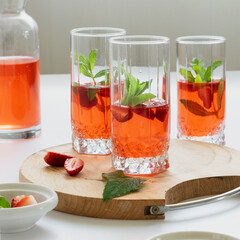 Refreshing summer drink with strawberry and mint