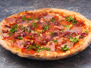 Bavarian pizza with ham, salami, smoked sausages