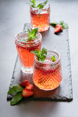 Refreshing summer drink with strawberry and mint