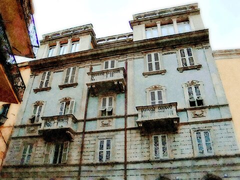 A glimpse of a historic building in a small town in Sardinia in Italy. Digital painting.