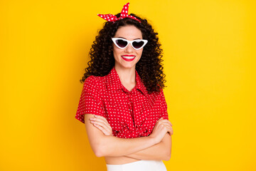 Photo of cute optimistic brunette hair lady crossed arms wear red top spectacles isolated on yellow color background