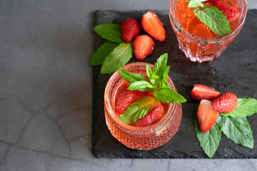 Refreshing summer drink with strawberry and mint