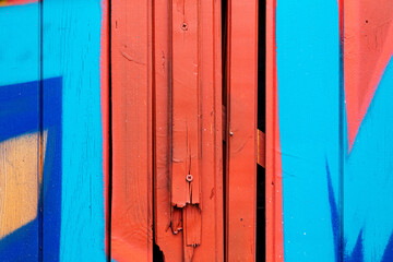 Wooden fence, background with wood planks painted with paint in close-up
