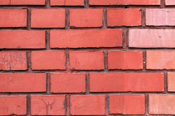 Obraz premium Smooth red brick, brick background in general, brickwork, background for photo, street wall