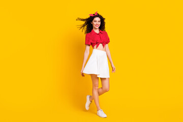 Full size photo of optimistic nice brunette lady stand wear shirt band skirt isolated on yellow color background