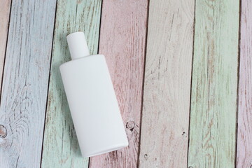 White plastic cosmetic bottle, sunscreen, cream, oil, facial hand skin care 