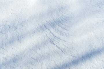 shadows and textures on white snow in winter