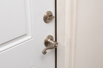 door handle and lock on white door security