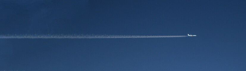 banner with airplane in the clear blue sky - horizontal trajectory of airplane - commercial...