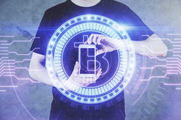 Double exposure of man's hands holding and using a phone and crypto currency blockchain theme drawing.
