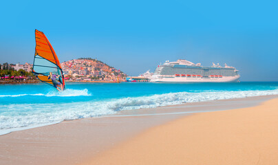 Windsurfer surfing the wind on sea waves - The cruise ship is located on Kusadasi Island in the...