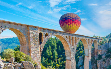 Hot air balloon flying over Varda railway bridge - Adana, Turkey