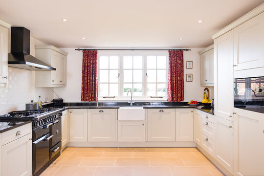 Shaker style farmhouse kitchen, painted wood UK kitchen interior