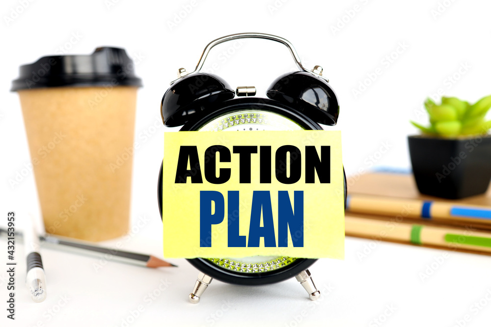 Fototapete action plan. there is a sticker on the alarm clock. against the background of a paper cup with coffe