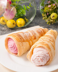 a tube of pink custard on a white plate
