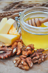 composition: jar of sweet honey, cheese, walnut