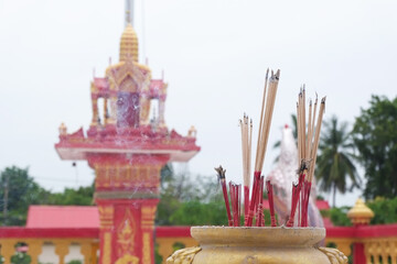 Incense in pot to worship with red shrine or guardian spirit and protect the area around the house according to Thai beliefs.