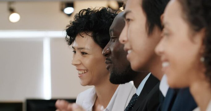 Successful conference, clapping and pull focus to smiling woman.