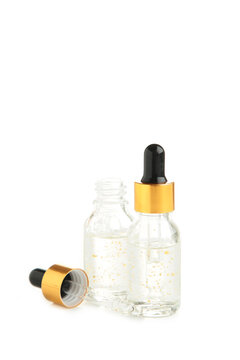 A glass bottles with a pipette with oil, serum isolated on white background with copy space. Flatlay