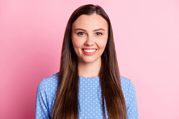 Photo of lovely funny girl beaming white smile wear dotted blue shirt isolated pastel pink color background