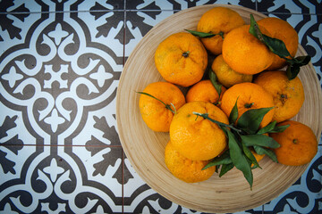 Tangerines in wooden bowl