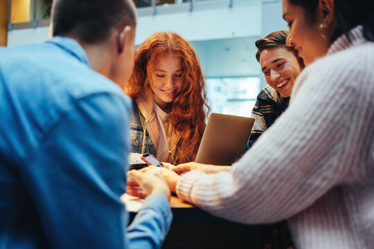 Students using their phones in library