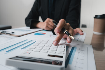 Fototapeta premium bookkeeper or financial inspector hands making report, calculating or checking balance. Home finances, investment, economy, saving money or insurance concept