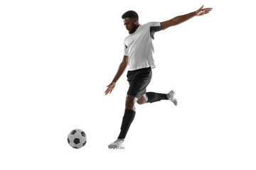 Fototapeta na wymiar One African man football player training isolated on white background. Concept of sport, movement, energy and dynamic.