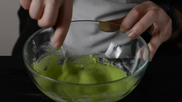 Whisking cake batter with a fork