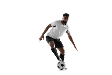 Plakat One African man football player training isolated on white background. Concept of sport, movement, energy and dynamic.