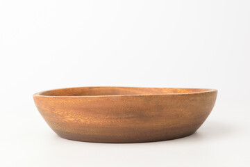 Wooden bowl on white background