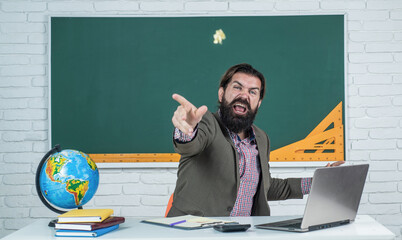 pure anger. angry mature teacher throwing paper. brutal bearded man work in classroom and feel...