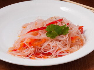 funchoza salad with Korean carrots on a white plate