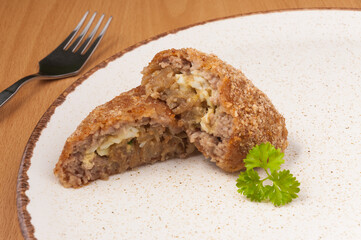 meat zrazy with onion and egg. close up