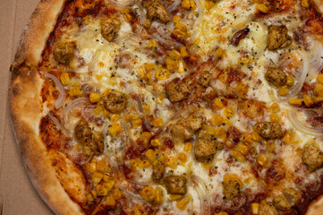 closeup of Hawaiian pizza with pineapple