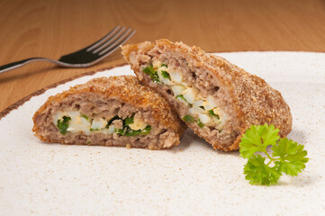 meat zrazy with green onion and egg. close up