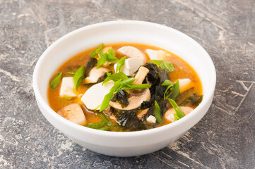 miso soup in a white bowl. Asian cuisine