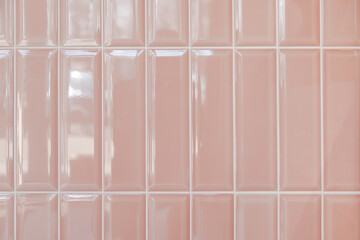 Pink glossy upright rectangular ceramic tile, background, texture