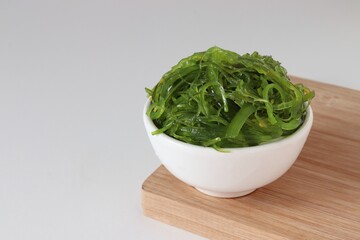 spicy wakame salad on white background, Traditional Japanese food