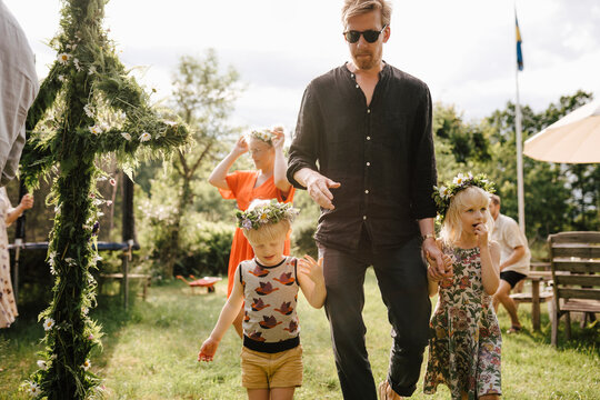 Father with children celebration midsummer
