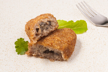 zrazy stuffed with mushrooms on a light plate. close up