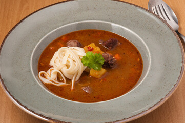 lagman soup with beef and noodles. close up