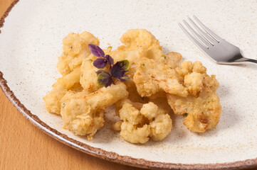 deep-fried cauliflower on a plate. close up