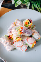 fresh springrolls with vegetables and shrimps. a healthy dish of rice paper and fresh organic vegetables