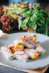 fresh springrolls with vegetables and shrimps. a healthy dish of rice paper and fresh organic vegetables