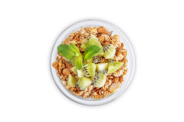 Kiwi Greek yogurt granola parfait in a glass on a white isolated background
