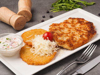 potato pancakes with breaded chicken fillet and cheese
